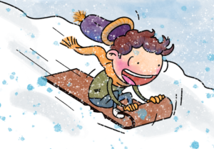 A boy toboggans down a snow covered hill, he looks excited even as his hat flies off and he holds on to the toboggan tightly.